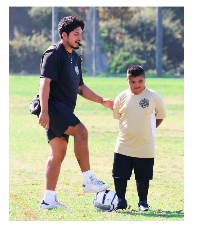 Youth Program Coordinator Gio with a soccer athlete